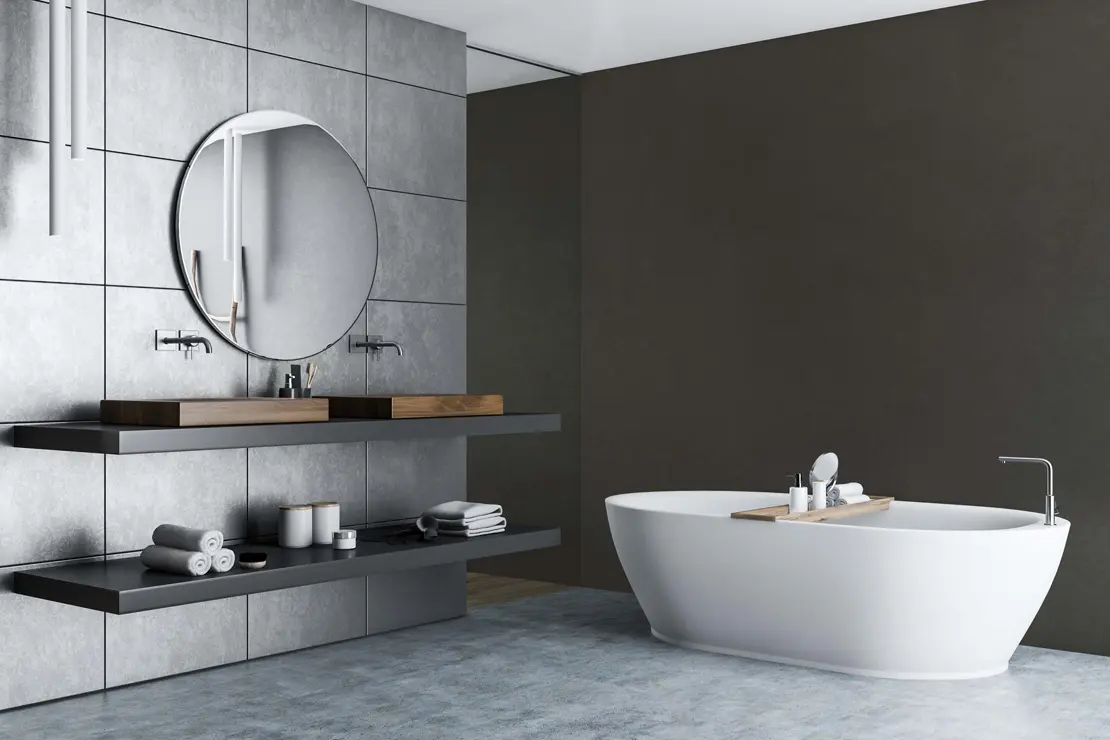 Salle de bain avec des murs en béton ciré de couleur gris foncé.